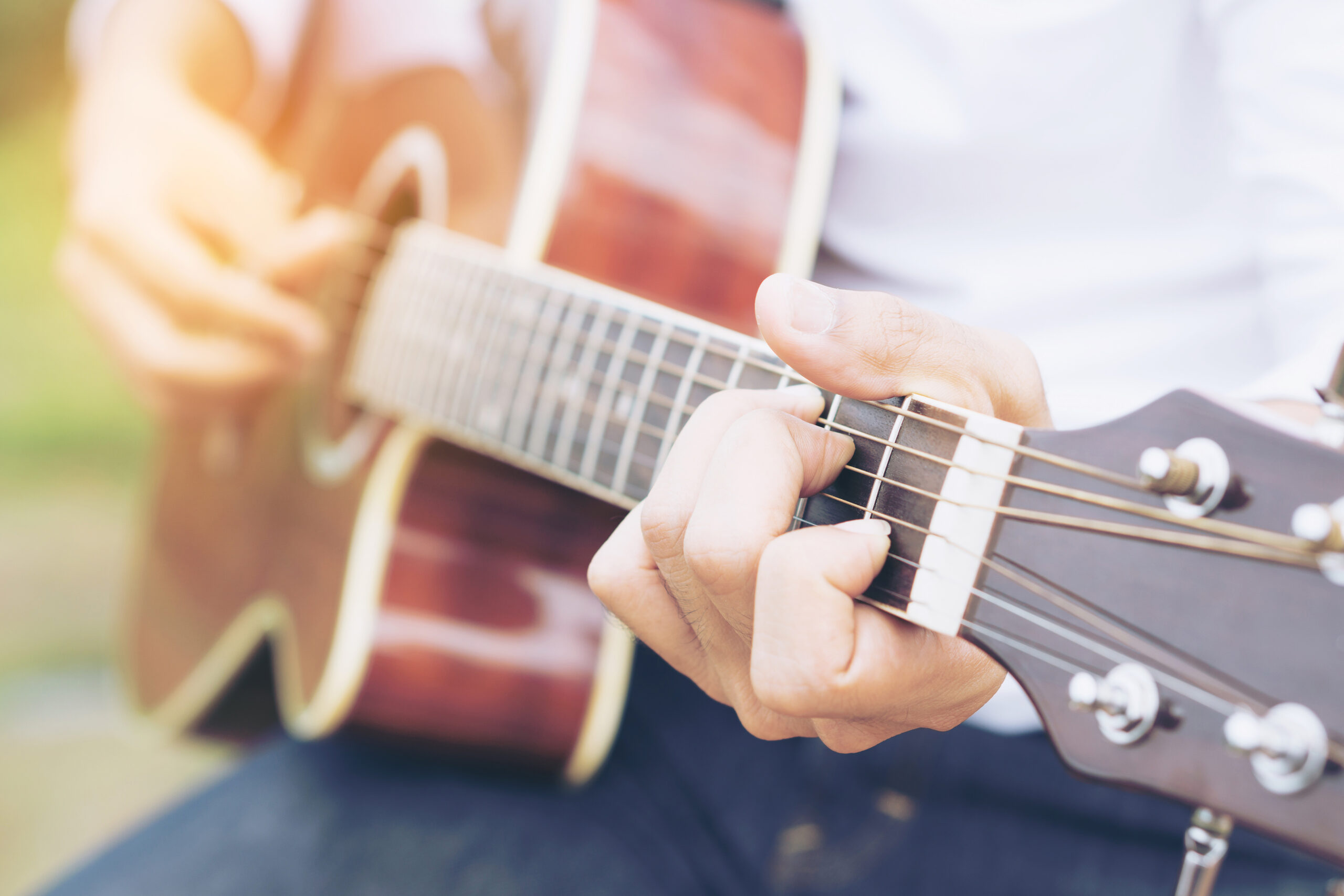 Man playing guitar outdoors