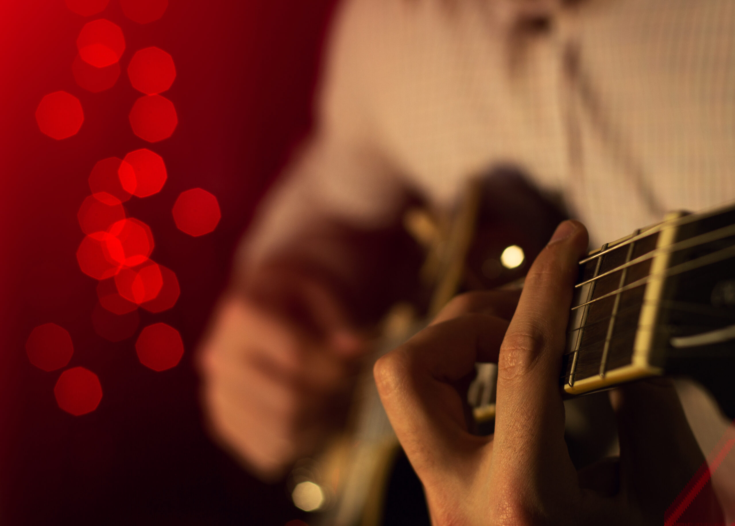 The artist plays the blues on stage. close-up