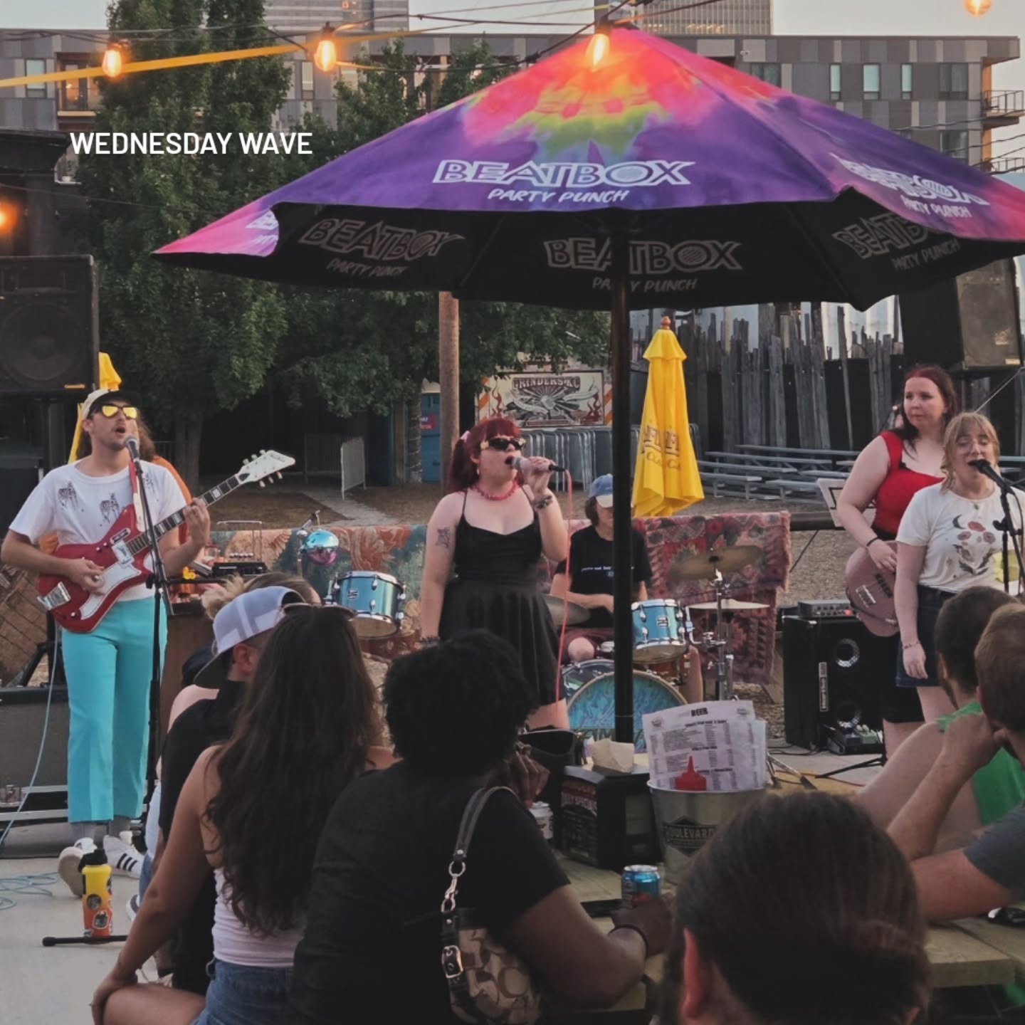 A band performing on the patio during a Wednesday Wave concert